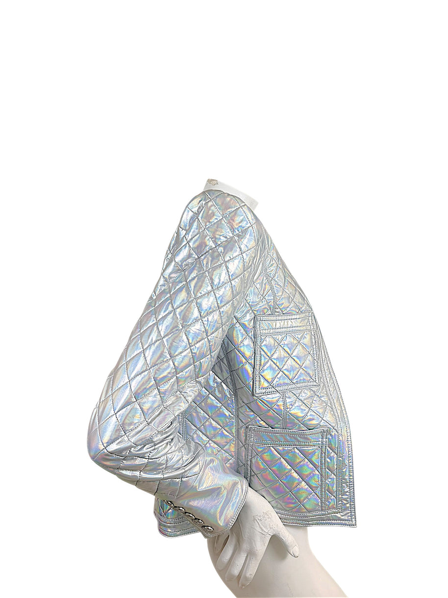 Side view of Balmain Fall 2018 holographic silver quilted runway jacket showing diamond quilting, patch pockets and button cuff