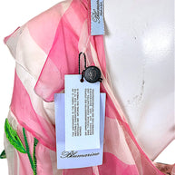 Blumarine original retail tag describing hand-crafted embroidery and natural silk thread on Spring 2016 runway dress