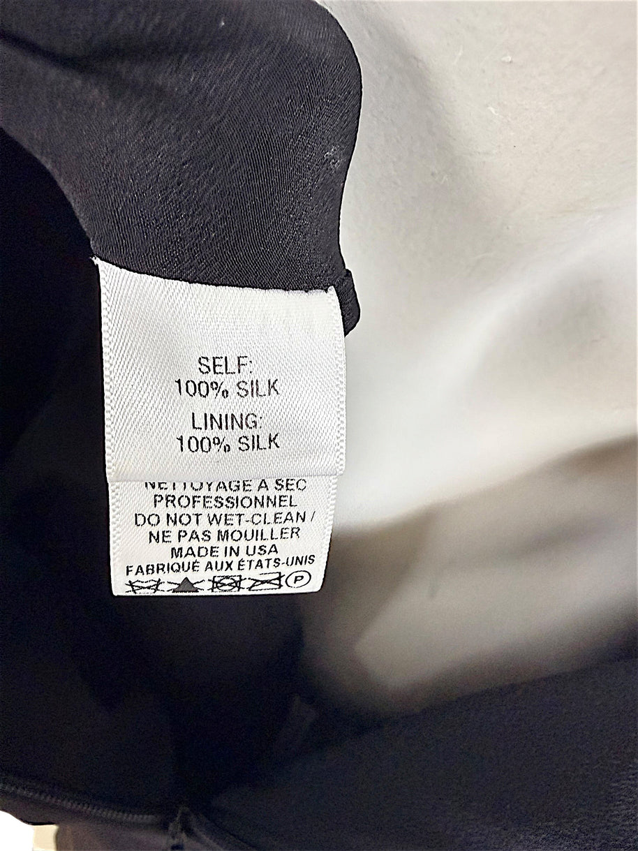 Carolina Herrera dress composition label showing 100 percent silk shell and silk lining Made in USA