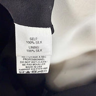 Carolina Herrera dress composition label showing 100 percent silk shell and silk lining Made in USA