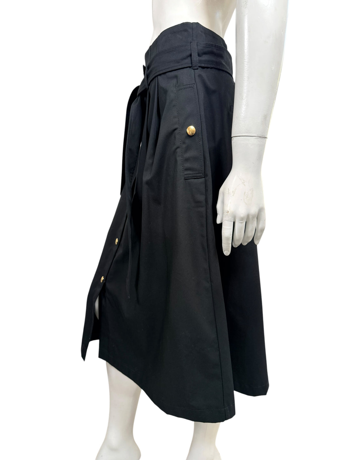 Opposite side view of Celine black belted cotton midi skirt displaying side pocket with gold-tone button and relaxed silhouette.