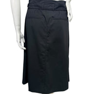 Back view of Celine black cotton midi skirt showing matching waist belt, rear welt pockets, center seam, and straight hemline.