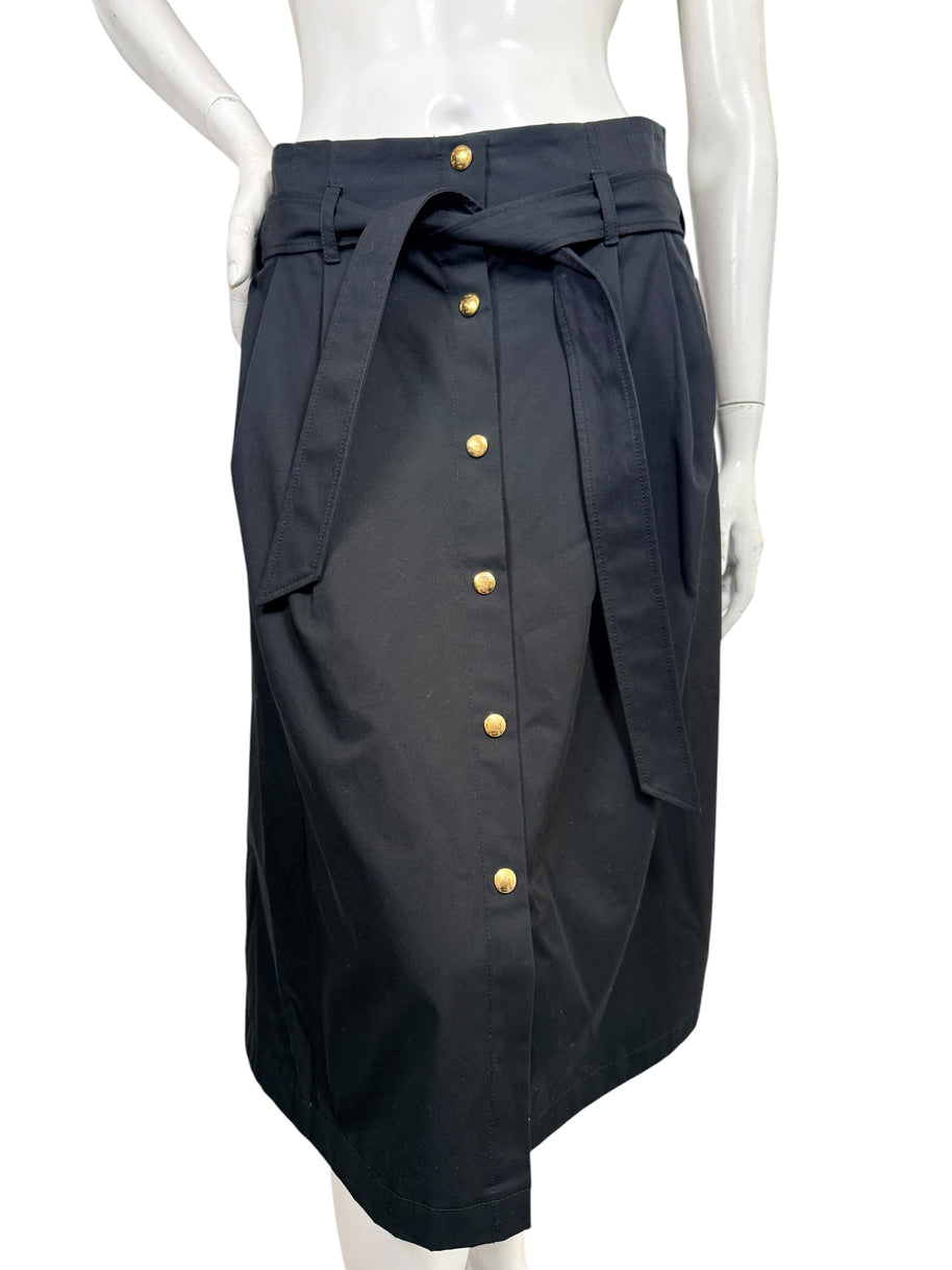 Celine black cotton belted midi skirt with gold-tone Triomphe buttons and front tie belt, shown on mannequin, size FR 38.