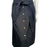 Celine black cotton belted midi skirt with gold-tone Triomphe buttons and front tie belt, shown on mannequin, size FR 38.