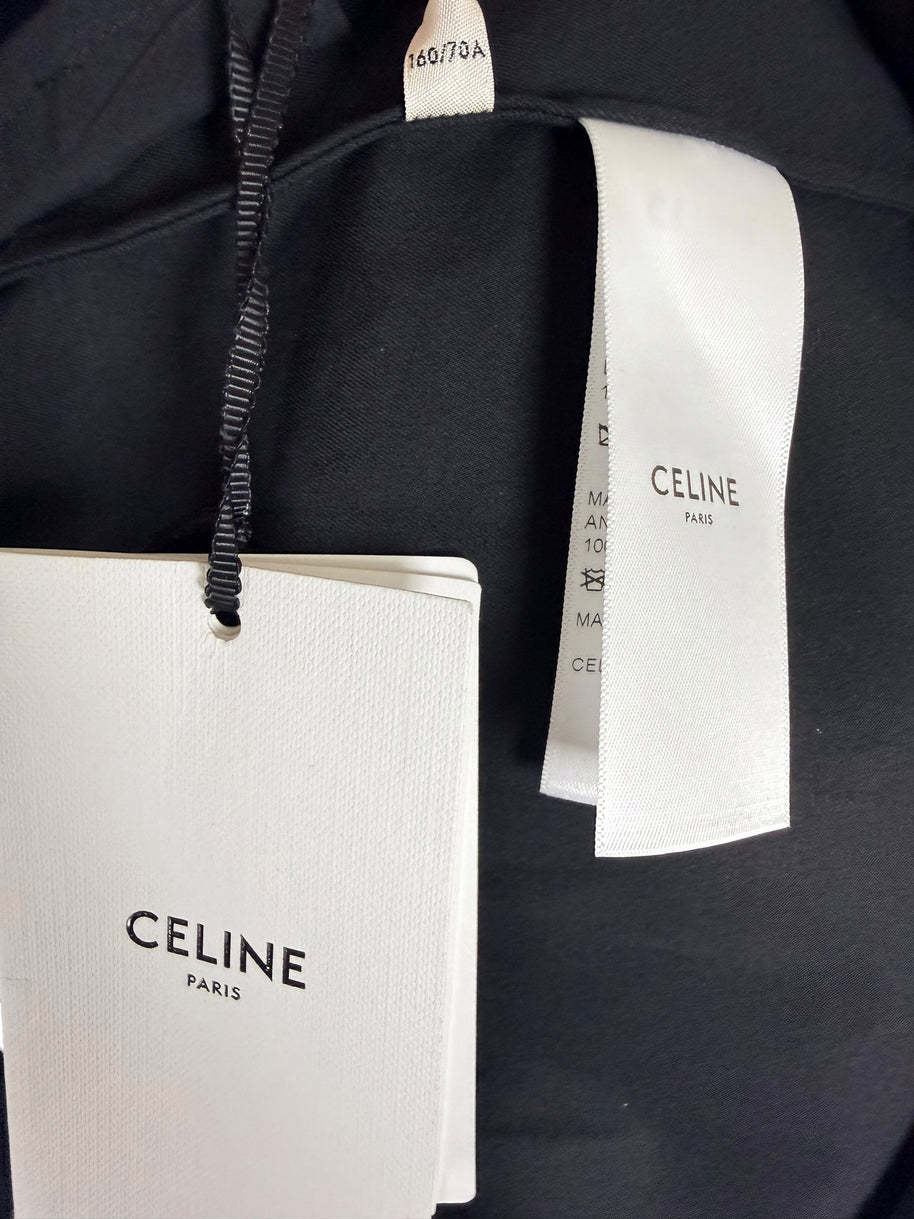 Original Celine Paris retail hangtag and interior designer labels attached to unworn black cotton midi skirt, new with tags.