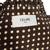Close-up of original Celine Paris designer label inside Fall Winter 2020 brown and cream polka dot silk runway dress.