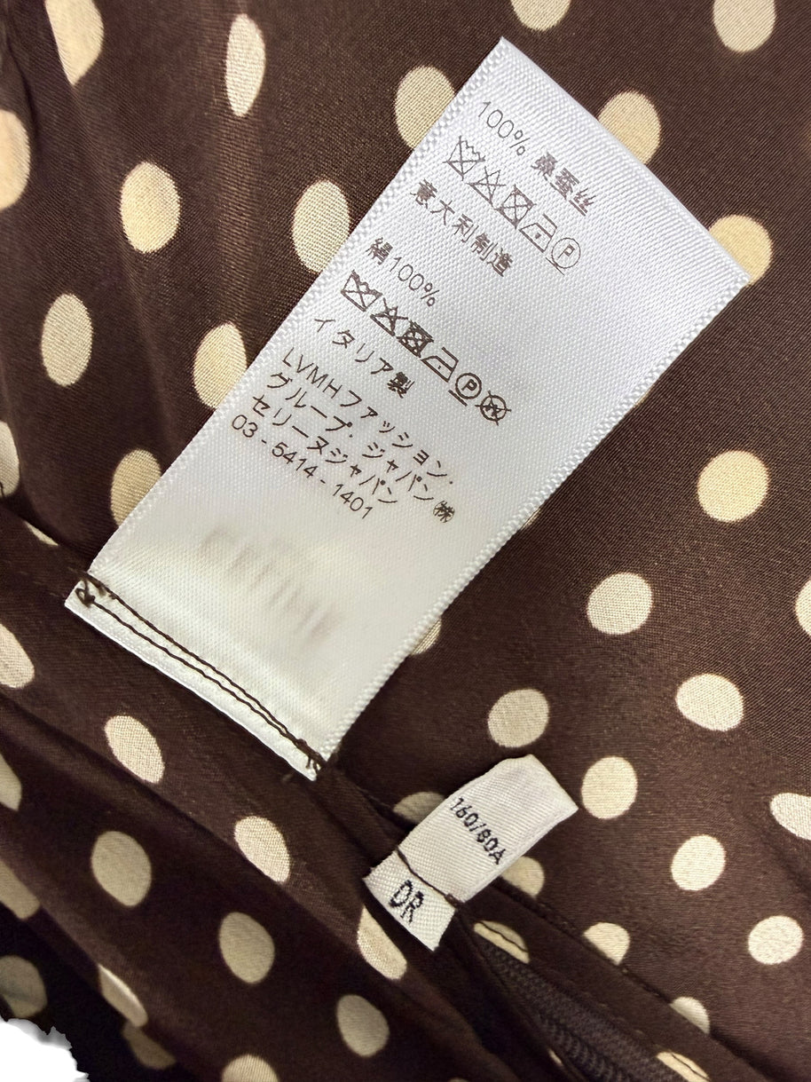 Original Japanese care label on Celine Fall 2020 polka dot silk runway dress showing silk composition, garment care symbols and identification tags.