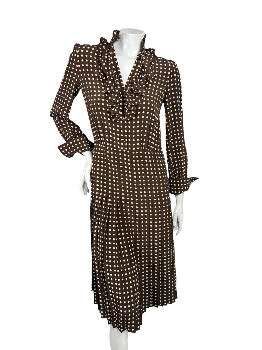 Celine Fall 2020 Runway Look 15 brown and cream polka dot silk midi dress with ruffled V-neckline and pleated skirt, front view.
