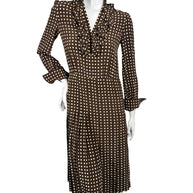 Celine Fall 2020 Runway Look 15 brown and cream polka dot silk midi dress with ruffled V-neckline and pleated skirt, front view.