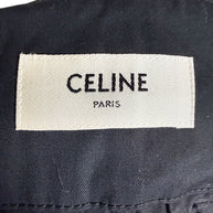 Interior Celine Paris woven designer label on black cotton belted midi skirt, showing original brand identification.