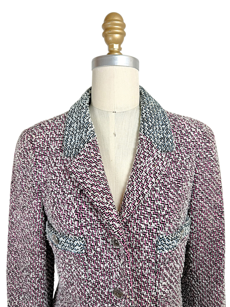 Close-up front view of vintage Chanel Spring 1996 tweed jacket featuring pink black and white woven texture and tailored lapels