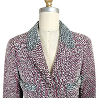 Close-up front view of vintage Chanel Spring 1996 tweed jacket featuring pink black and white woven texture and tailored lapels