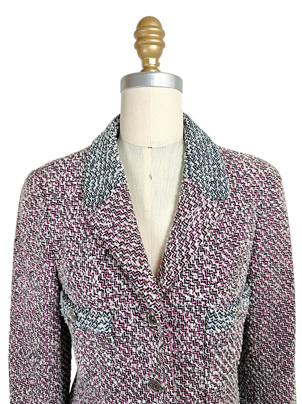 Close-up front view of vintage Chanel Spring 1996 tweed jacket featuring pink black and white woven texture and tailored lapels