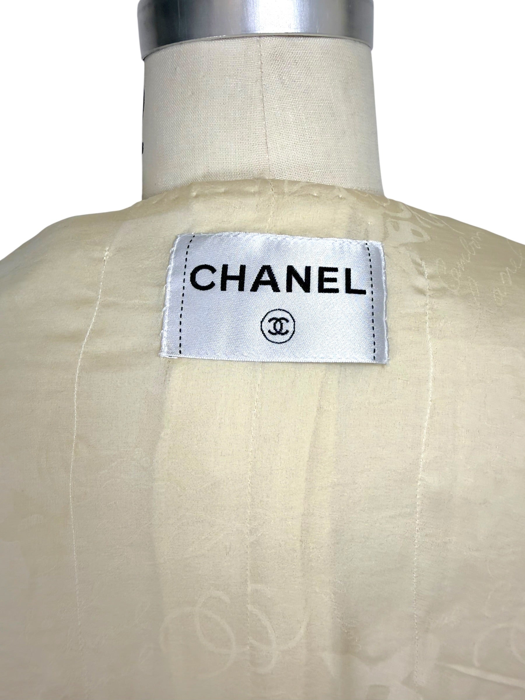 Close-up of Chanel label inside vintage 1998 ivory bouclé tweed jacket lining