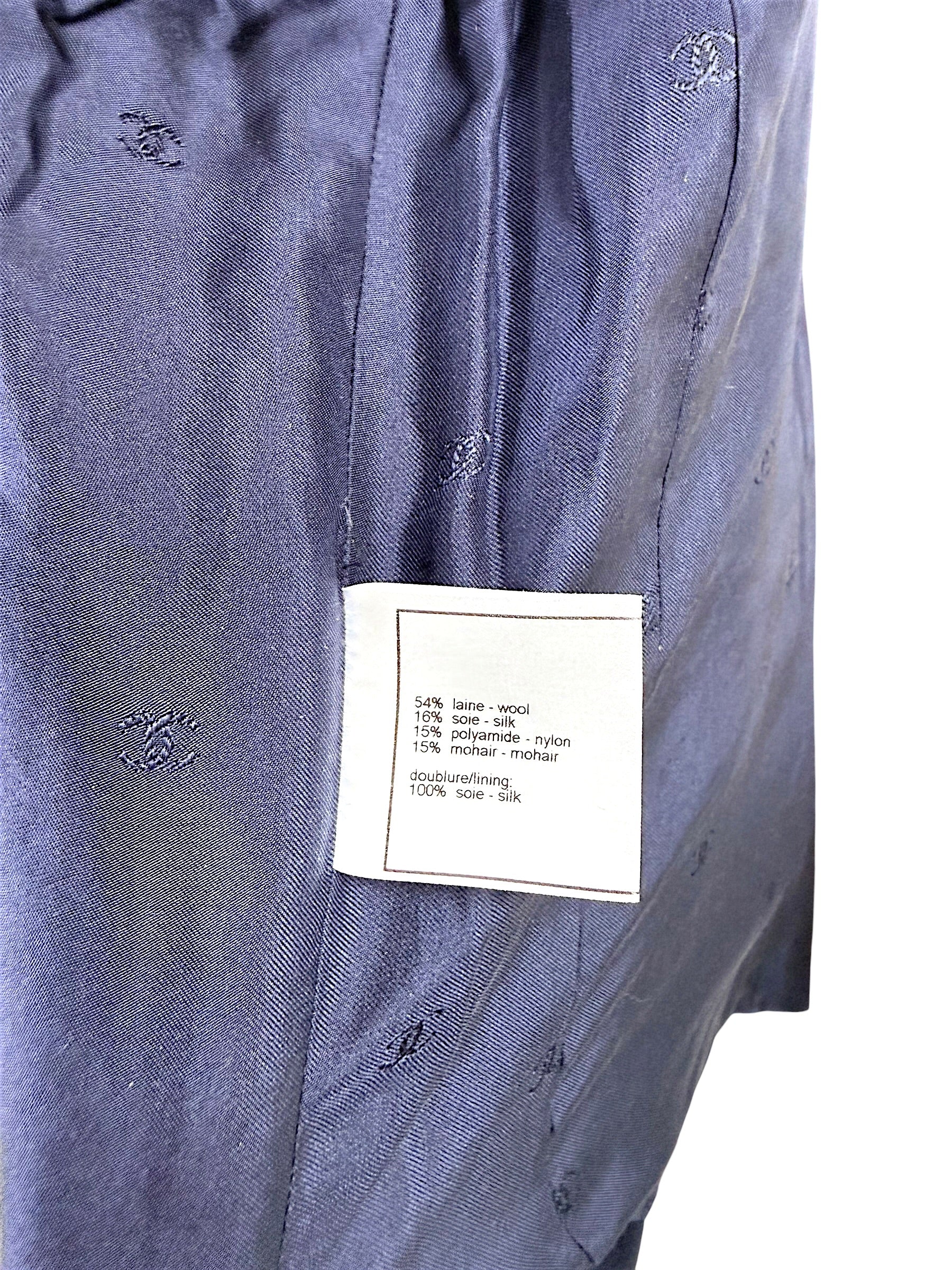 Interior composition tag showing wool silk nylon and mohair blend with silk lining on Chanel 1998 jacket