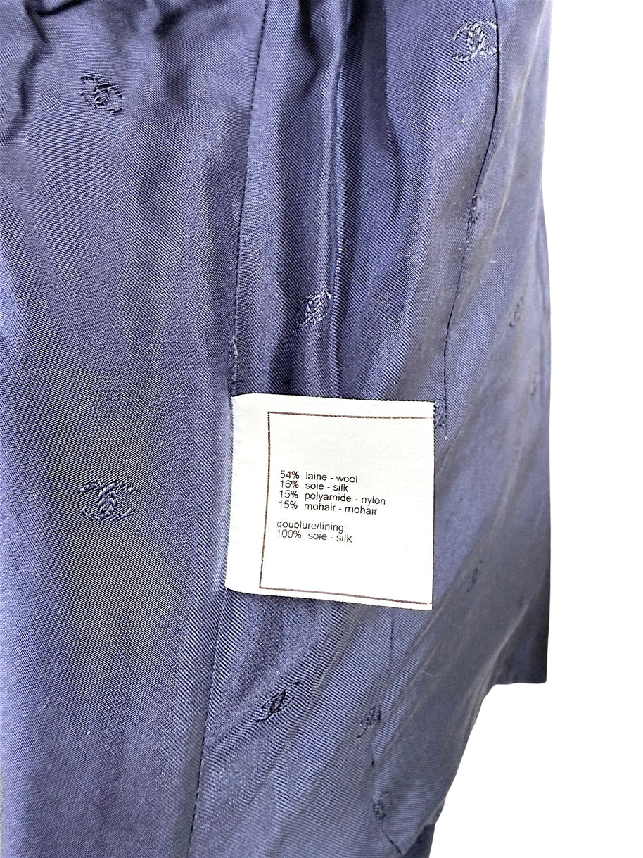 Interior composition tag showing wool silk nylon and mohair blend with silk lining on Chanel 1998 jacket