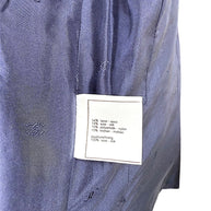 Interior composition tag showing wool silk nylon and mohair blend with silk lining on Chanel 1998 jacket
