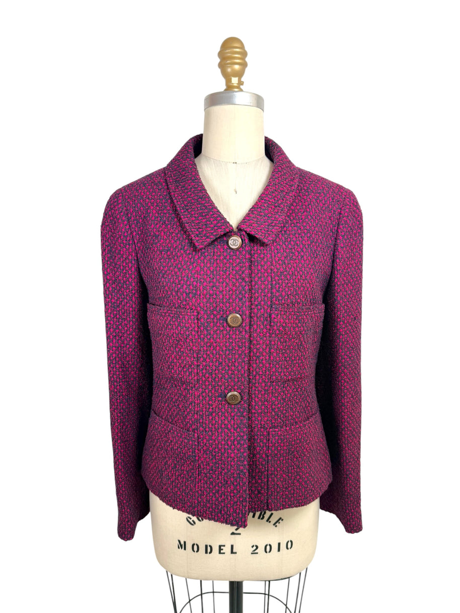 Vintage Chanel 1998 fuchsia and navy tweed jacket front view with CC logo buttons and pointed collar on mannequin