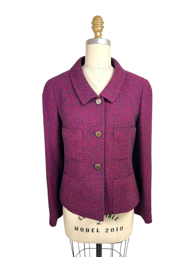 Vintage Chanel 1998 fuchsia and navy tweed jacket front view with CC logo buttons and pointed collar on mannequin