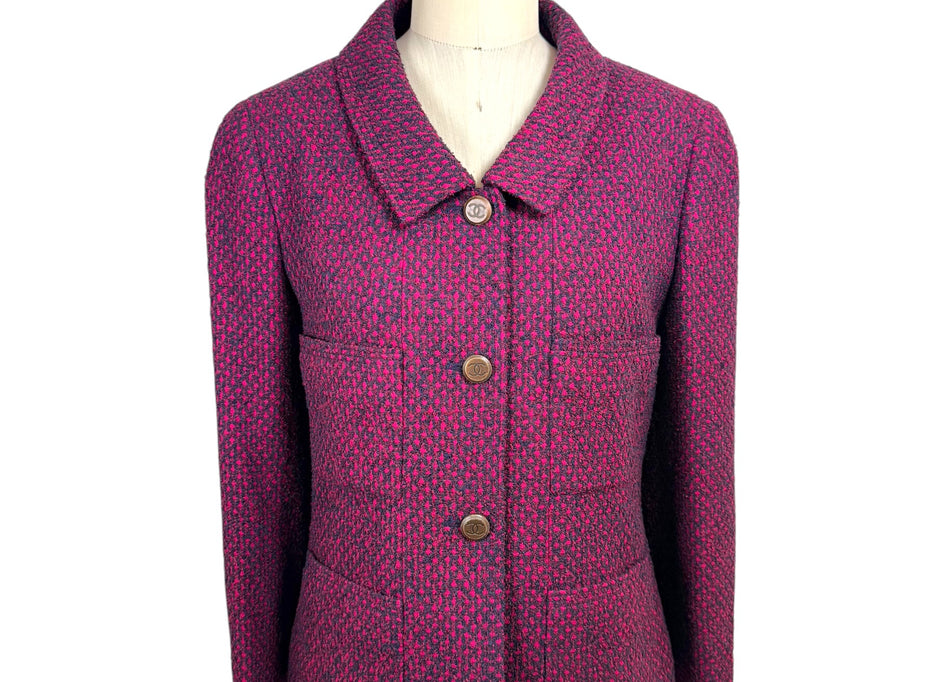 Vintage Chanel 1998 fuchsia and navy tweed jacket front view with CC logo buttons and pointed collar on mannequin