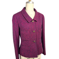 Three-quarter front view of vintage Chanel 1998 pink and navy tweed jacket with structured tailoring