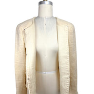Interior view of 1998 Chanel ivory bouclé jacket with silk camellia jacquard lining and hook closures