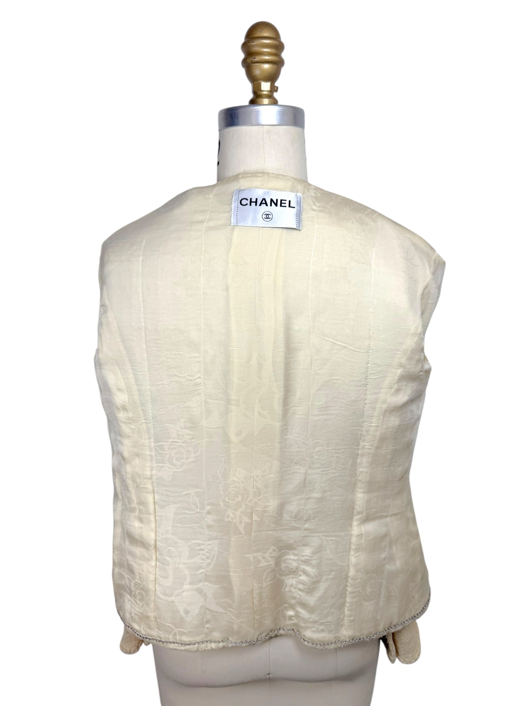 Interior silk camellia jacquard lining of vintage Chanel 1998 ivory bouclé jacket
