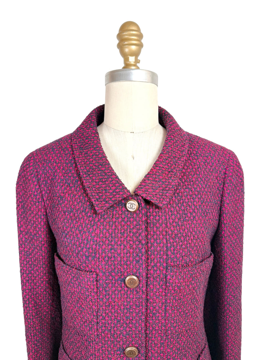 Close-up front detail of Chanel 1998 fuchsia and navy tweed jacket featuring engraved CC logo buttons