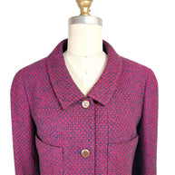 Close-up front detail of Chanel 1998 fuchsia and navy tweed jacket featuring engraved CC logo buttons