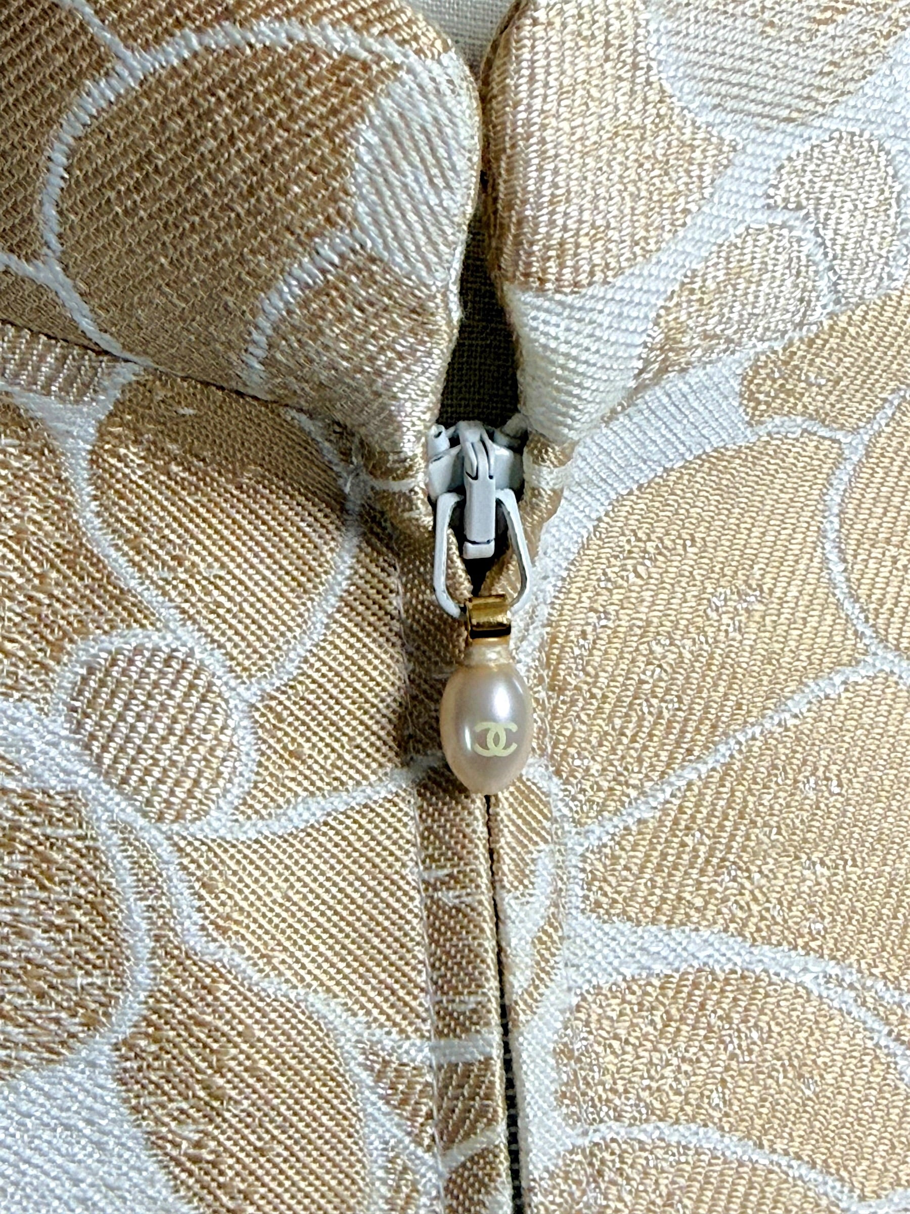Chanel CC logo zipper pull detail on Spring 2001 runway vest