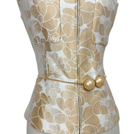 Chanel runway vest front structure with pearl chain belt and tailored peplum waist