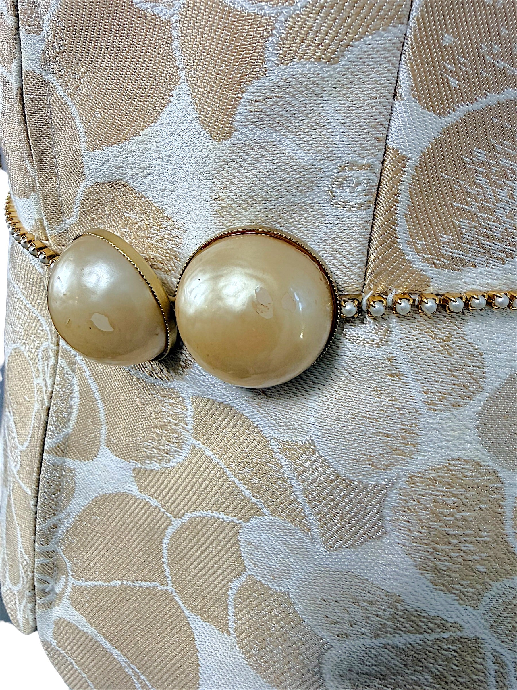 Chanel runway vest pearl belt close up showing light wear on oversized pearls