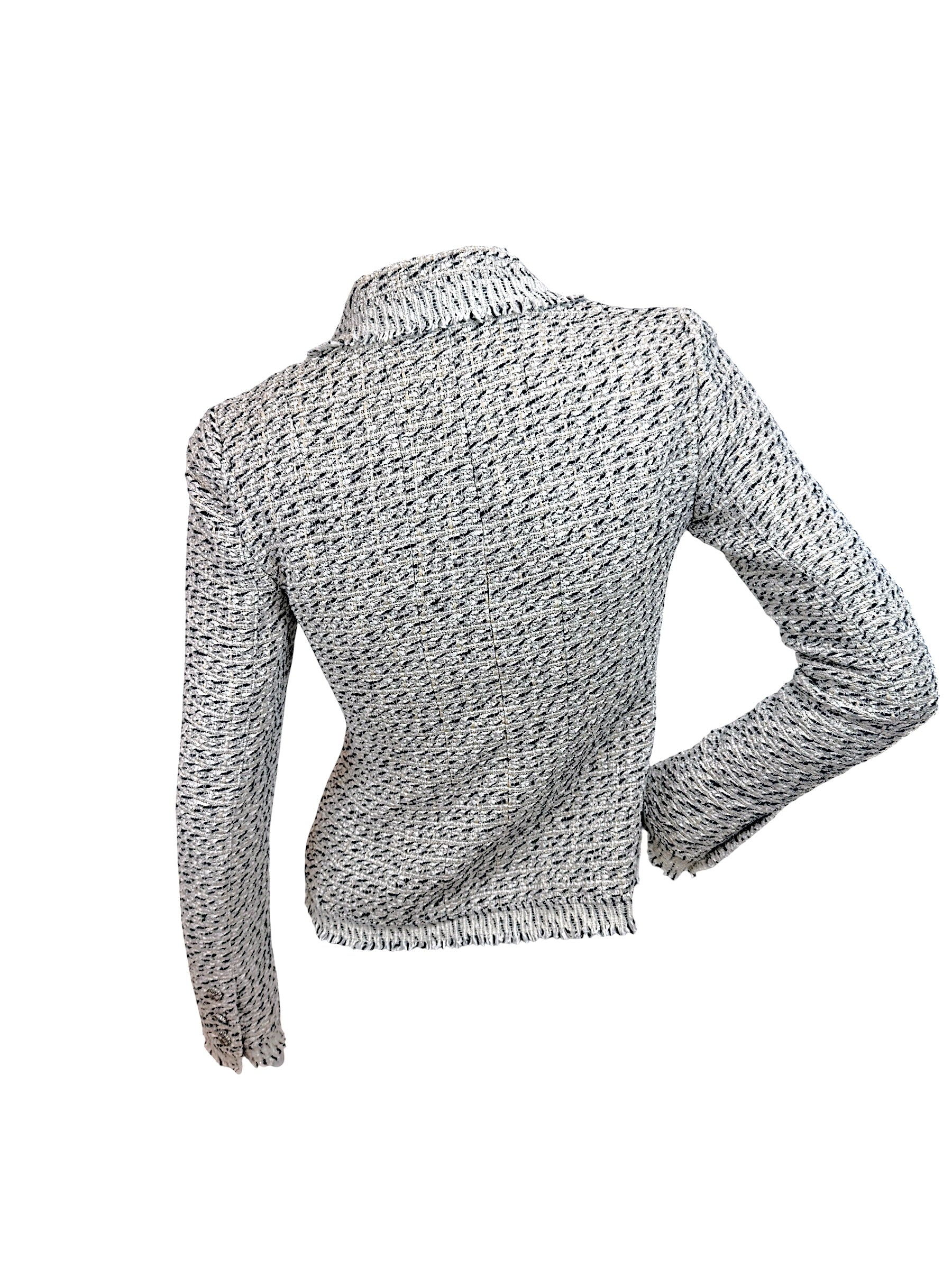 Back view of Chanel 2004 Lesage tweed fringe jacket showing fitted silhouette and textured boucle construction