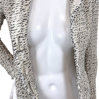 Side interior detail of Chanel 2004 Lesage tweed jacket showing signature weighted chain and silk lining