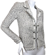 Angled front view of Chanel 2004 fitted Lesage tweed jacket with fringe trim and tailored silhouette