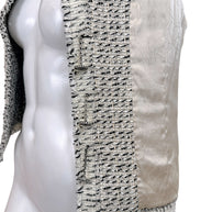 Side interior detail of Chanel 2004 Lesage tweed jacket showing signature weighted chain and silk lining