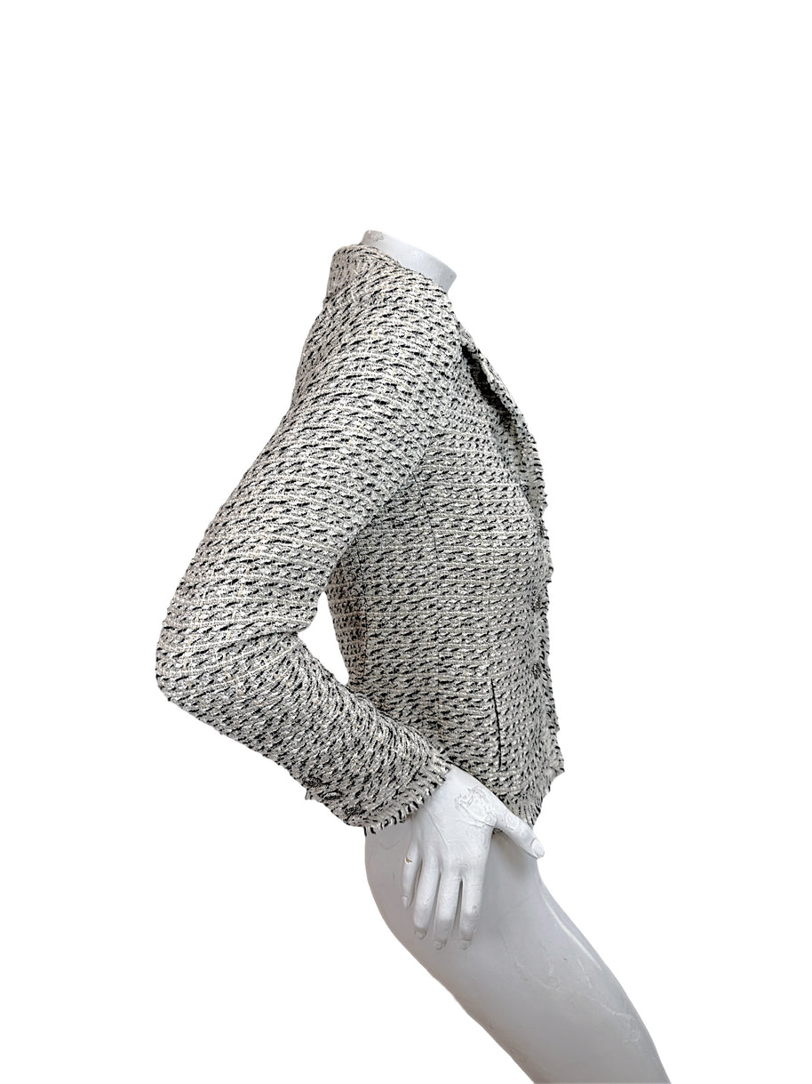Right side profile of Chanel 2004 ivory cream black Lesage tweed jacket with long sleeves and fringe trim