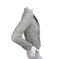 Right side profile of Chanel 2004 ivory cream black Lesage tweed jacket with long sleeves and fringe trim