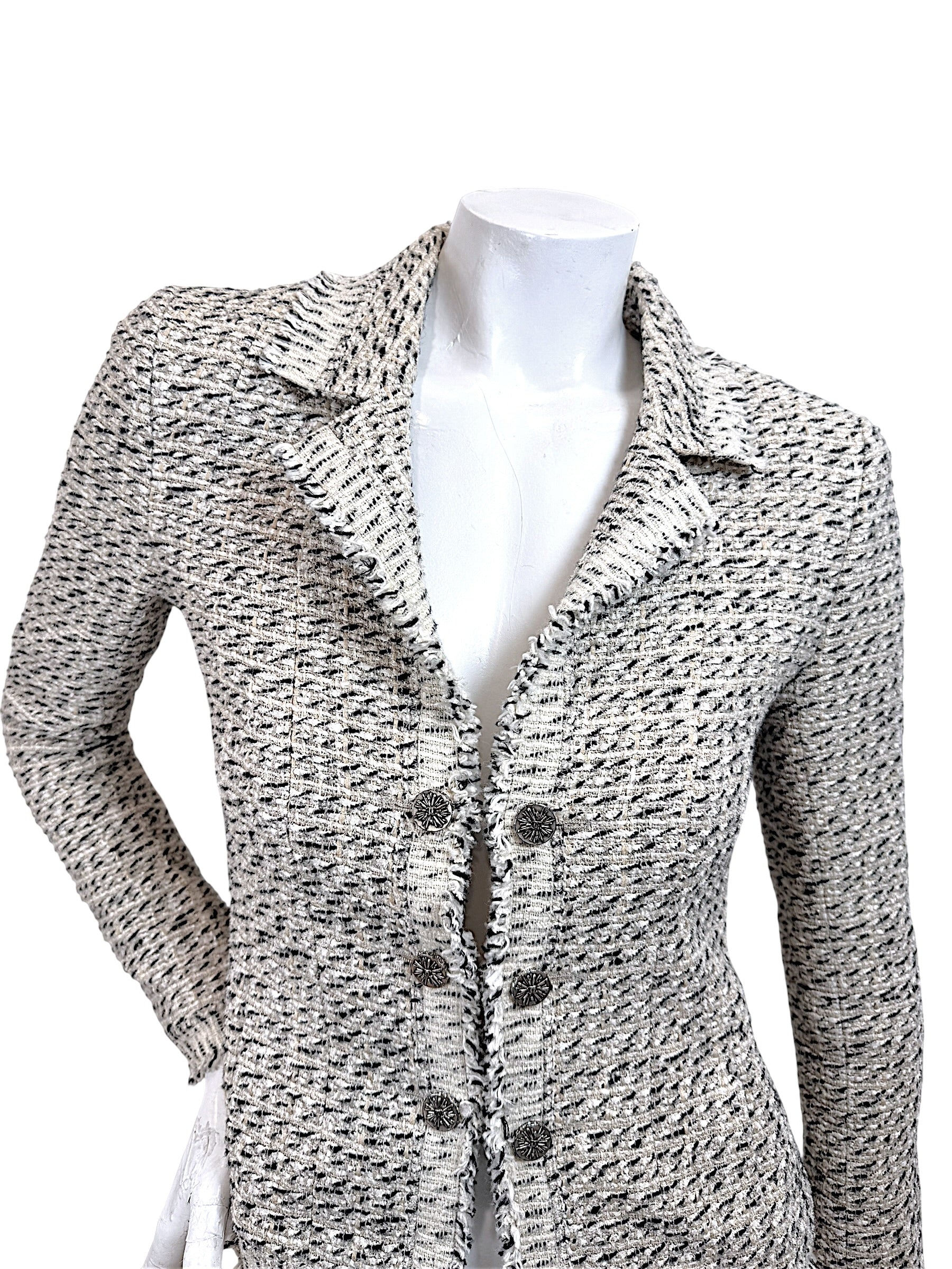 Close-up front detail of Chanel 2004 Lesage tweed jacket featuring textured boucle weave fringe trim and ornate Chanel buttons