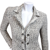 Close-up front detail of Chanel 2004 Lesage tweed jacket featuring textured boucle weave fringe trim and ornate Chanel buttons