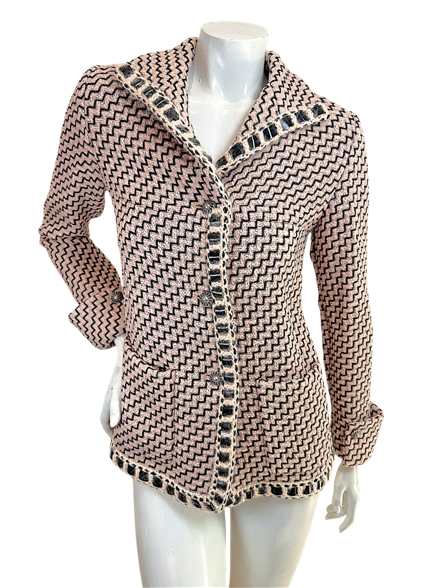 Chanel Pre-Fall 2016 runway jacket Look 36 pink black tweed front view with boucle trim and signature Chanel buttons
