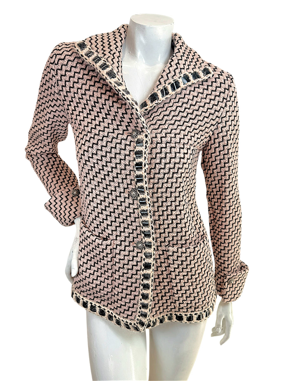 Chanel Pre-Fall 2016 runway jacket Look 36 pink black tweed front view with boucle trim and signature Chanel buttons