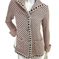 Chanel Pre-Fall 2016 runway jacket Look 36 pink black tweed front view with boucle trim and signature Chanel buttons