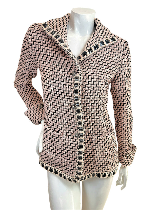 Chanel Pre-Fall 2016 runway jacket Look 36 pink black tweed front view with boucle trim and signature Chanel buttons