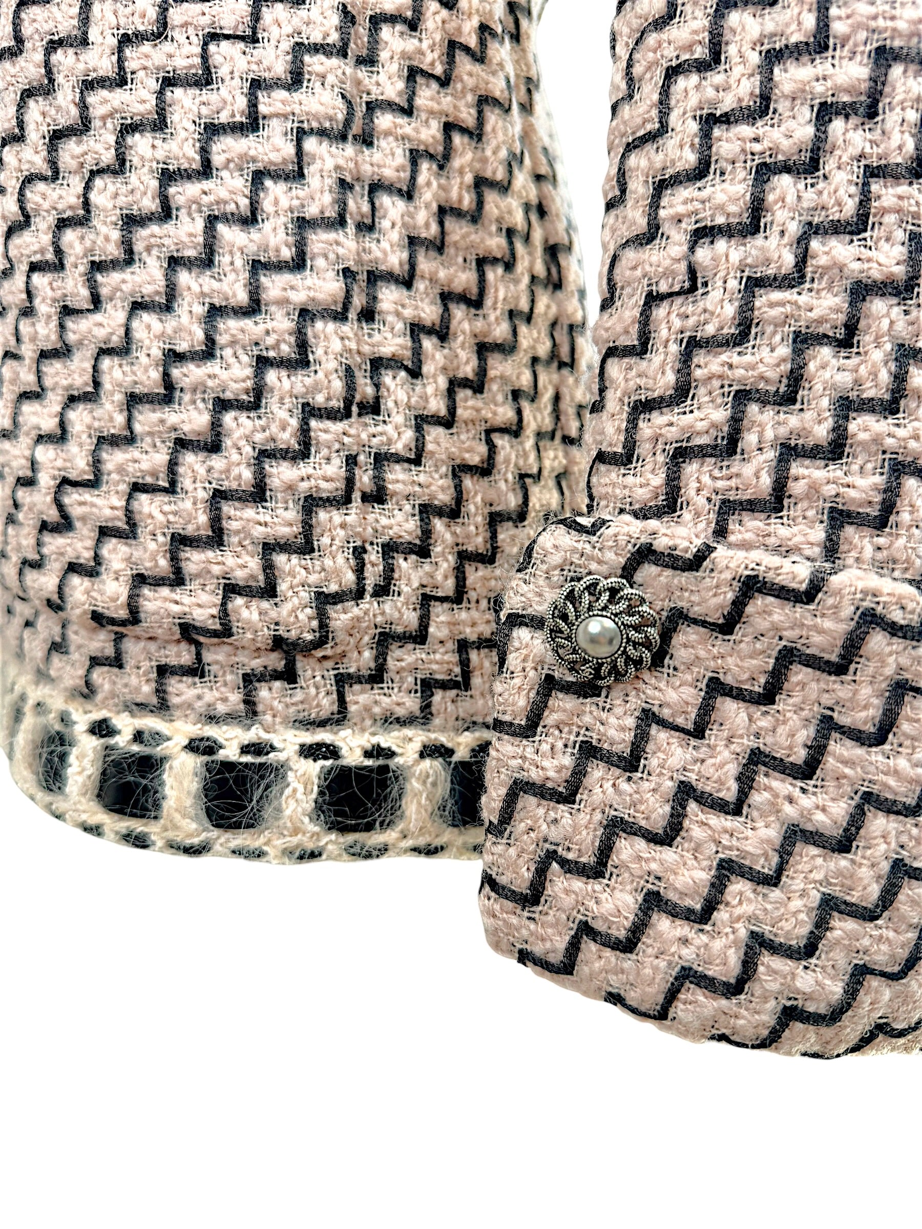 Chanel Pre-Fall 2016 jacket sleeve detail with signature button and boucle trim cuff