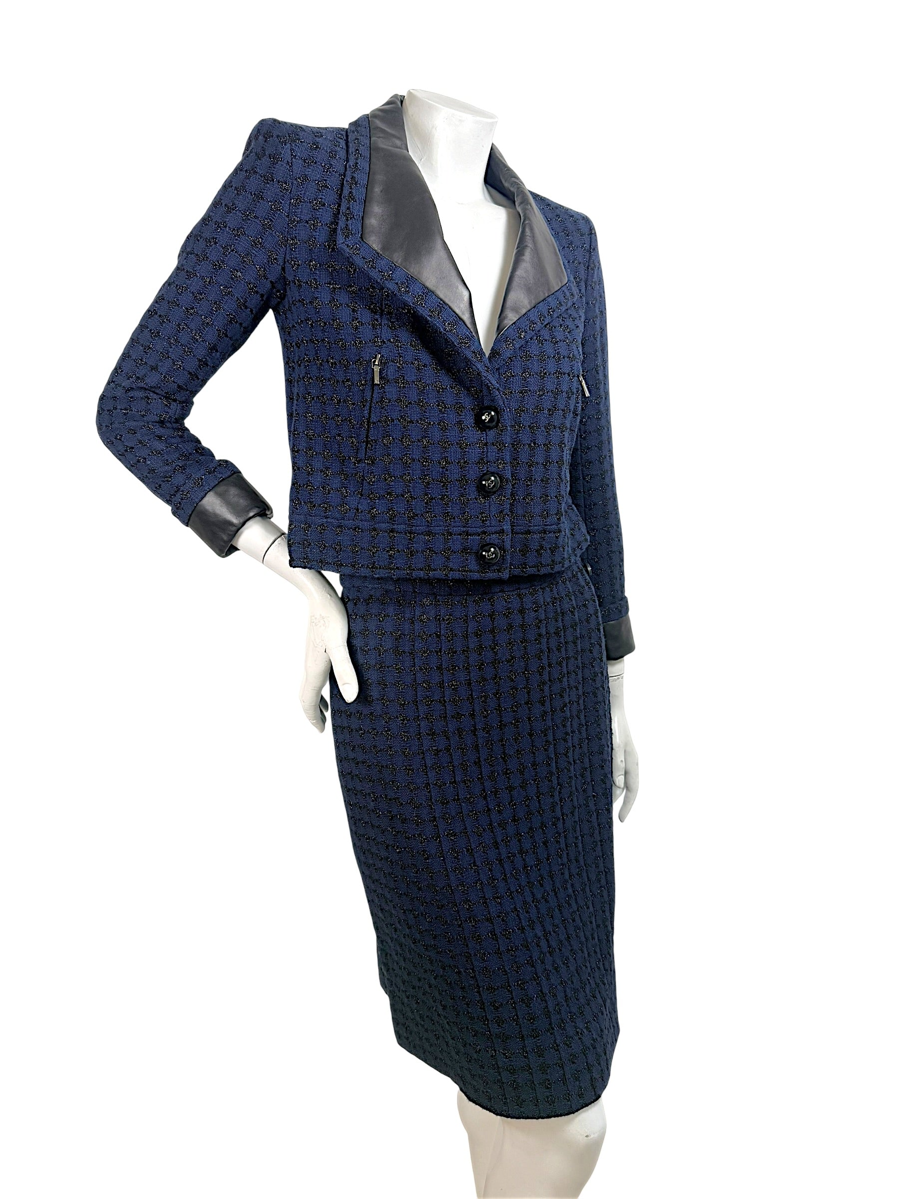 Chanel 2016 tweed skirt suit angled front view showing tailored silhouette and texture