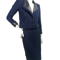 Chanel 2016 tweed skirt suit angled front view showing tailored silhouette and texture