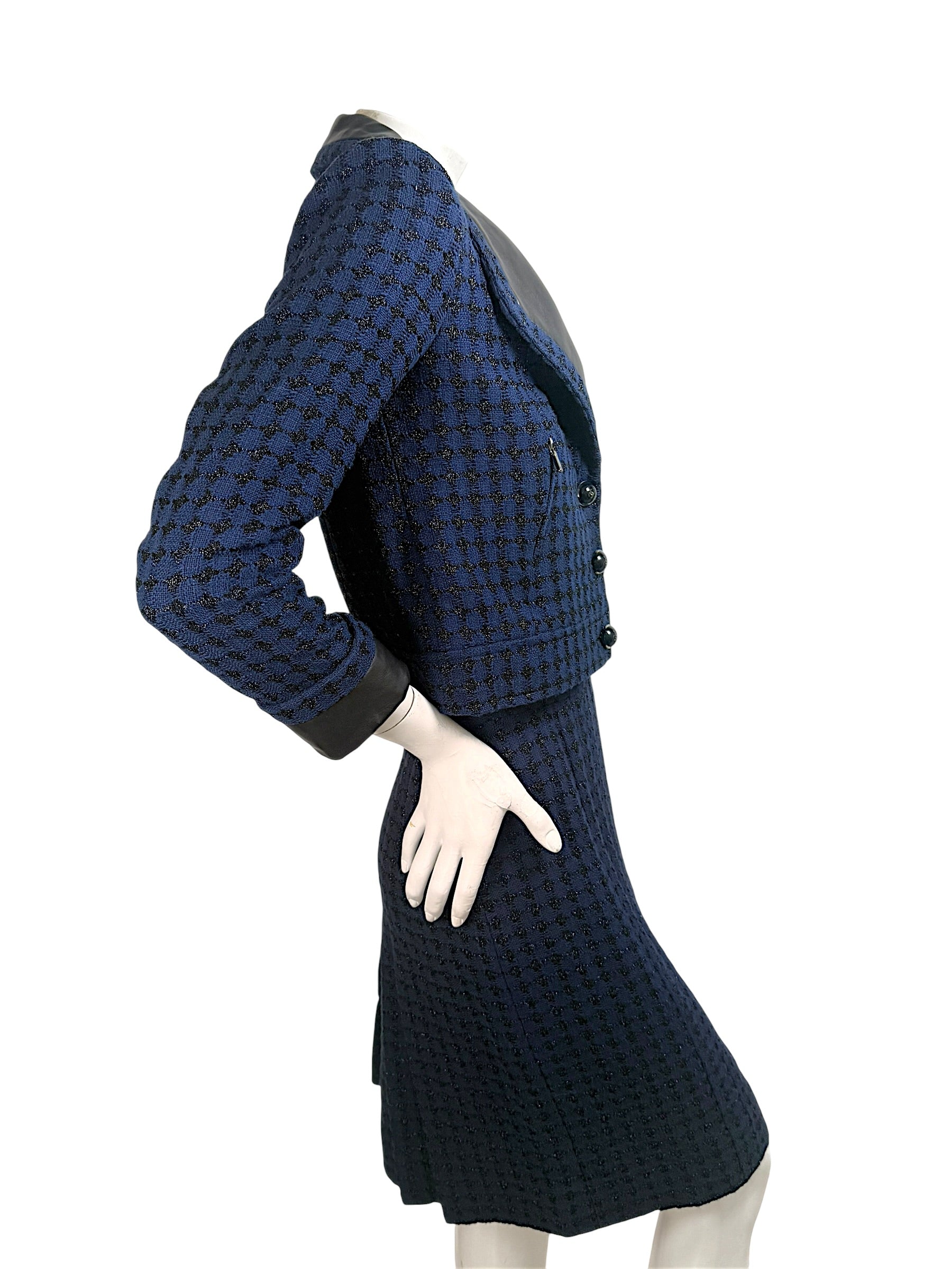 Chanel tweed suit side view highlighting tailored waist and structured fit