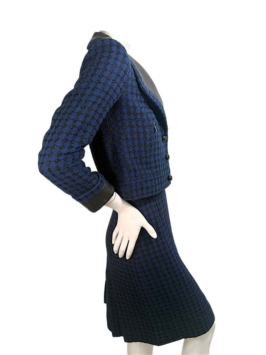Chanel tweed suit side view highlighting tailored waist and structured fit