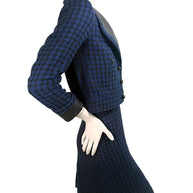 Chanel tweed suit side view highlighting tailored waist and structured fit